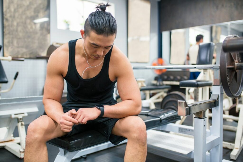 body builder checking his vitals on a smartwatch royalty free image 1697550218