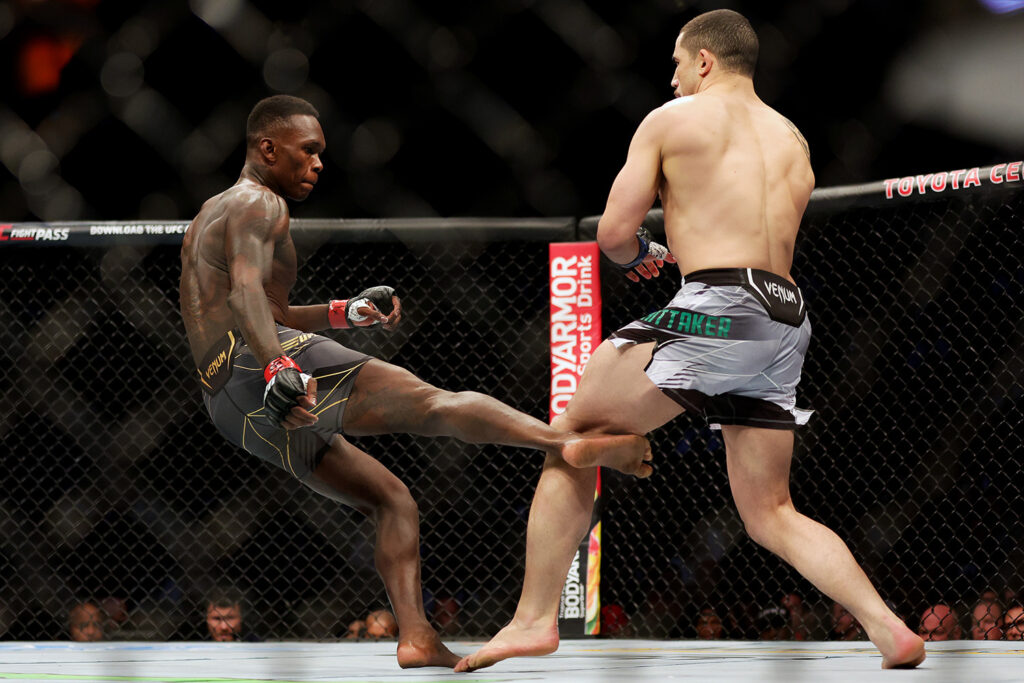 Adesanya kicks Whittaker in the UFC 271 middleweight championship fight