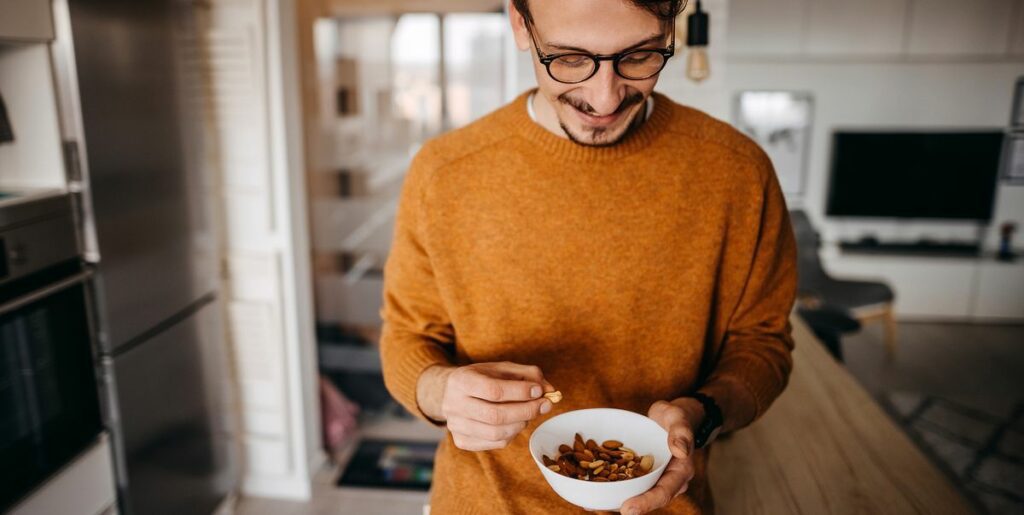 man with bow of nuts